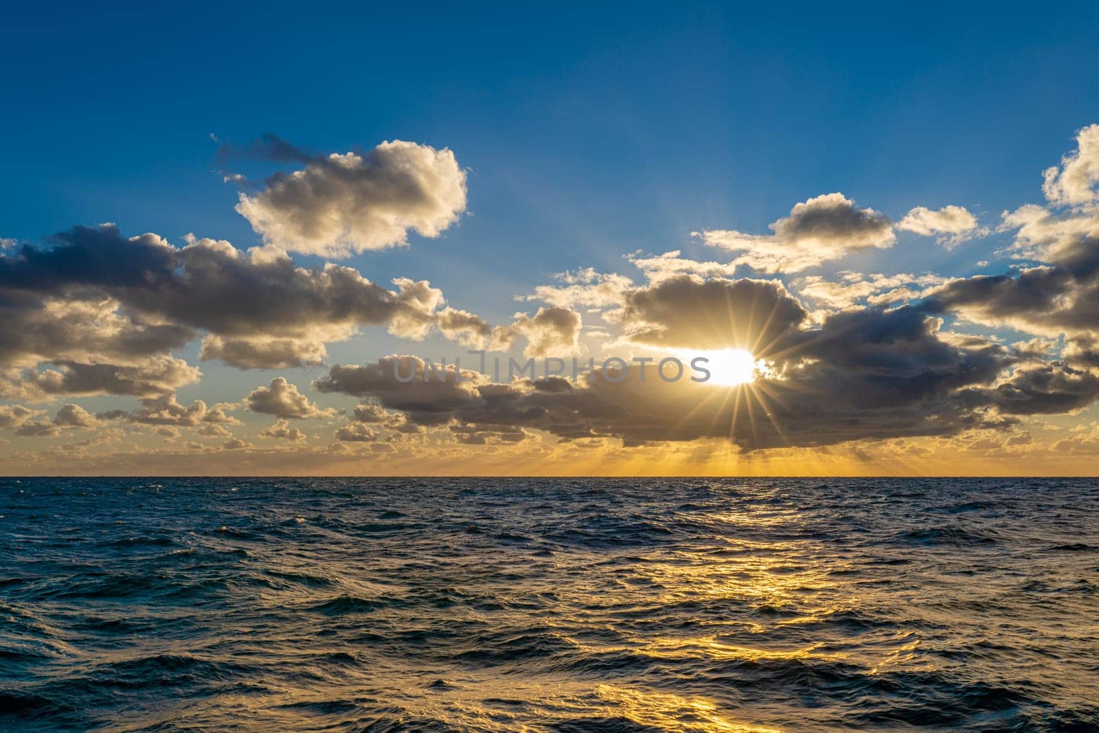 dreamlike sunset panorama on the open wide sea