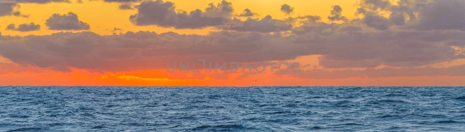 dreamlike sunset panorama on the open wide sea