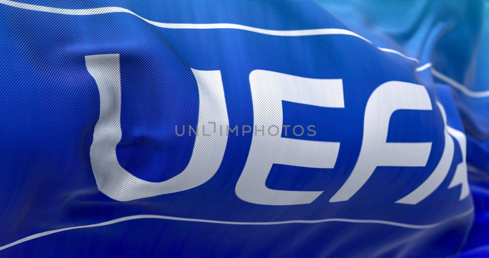 Nyon, CH, September 2022: flag with the UEFA logo waving in the wind. UEFA is the association that manages professional football in Europe. Illustrative editorial 3d illustration render