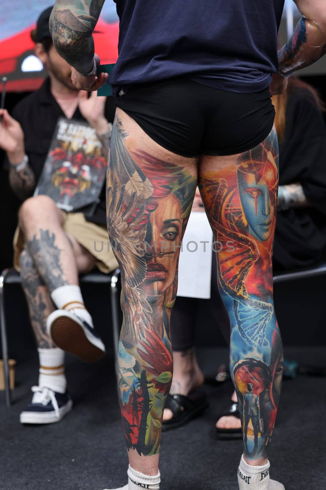 Krakow, Poland - June 12, 2022: Unidentified participant during the contest for the best tattoo at the 15th Tattoofest Convention in Cracow. One of the most prestigious tattoo festivals.