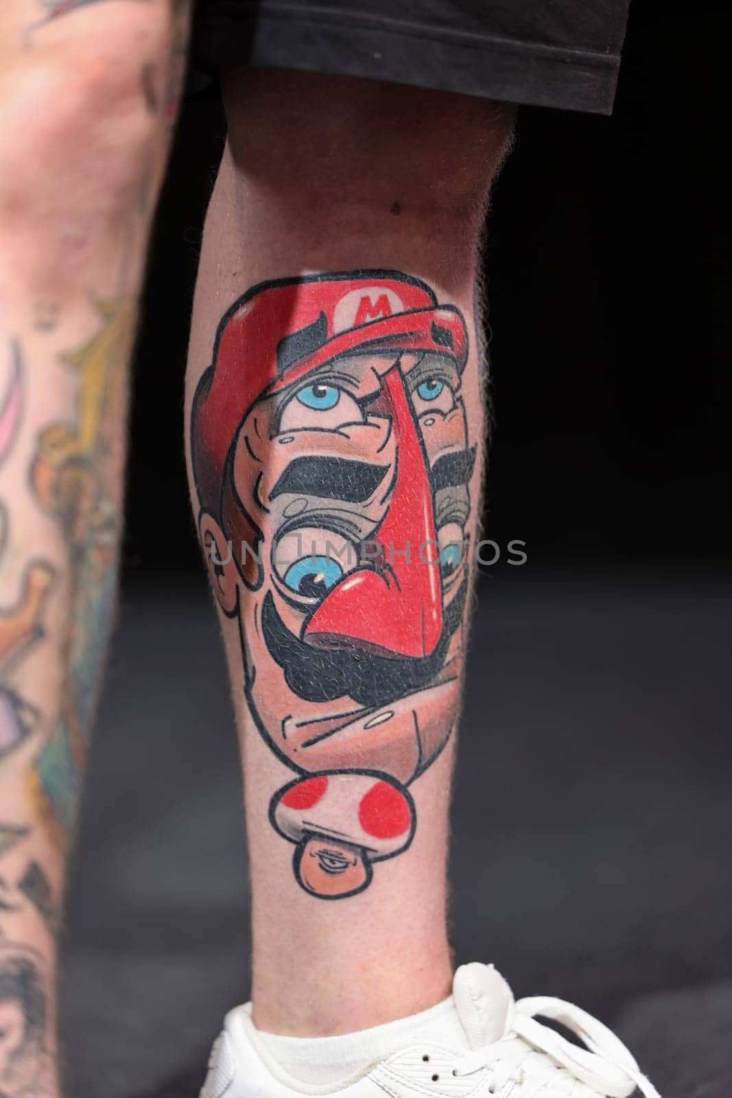 Krakow, Poland - June 11, 2022: Unidentified participant during the contest for the best tattoo at the 15th Tattoofest Convention in Cracow. One of the most prestigious tattoo festivals.