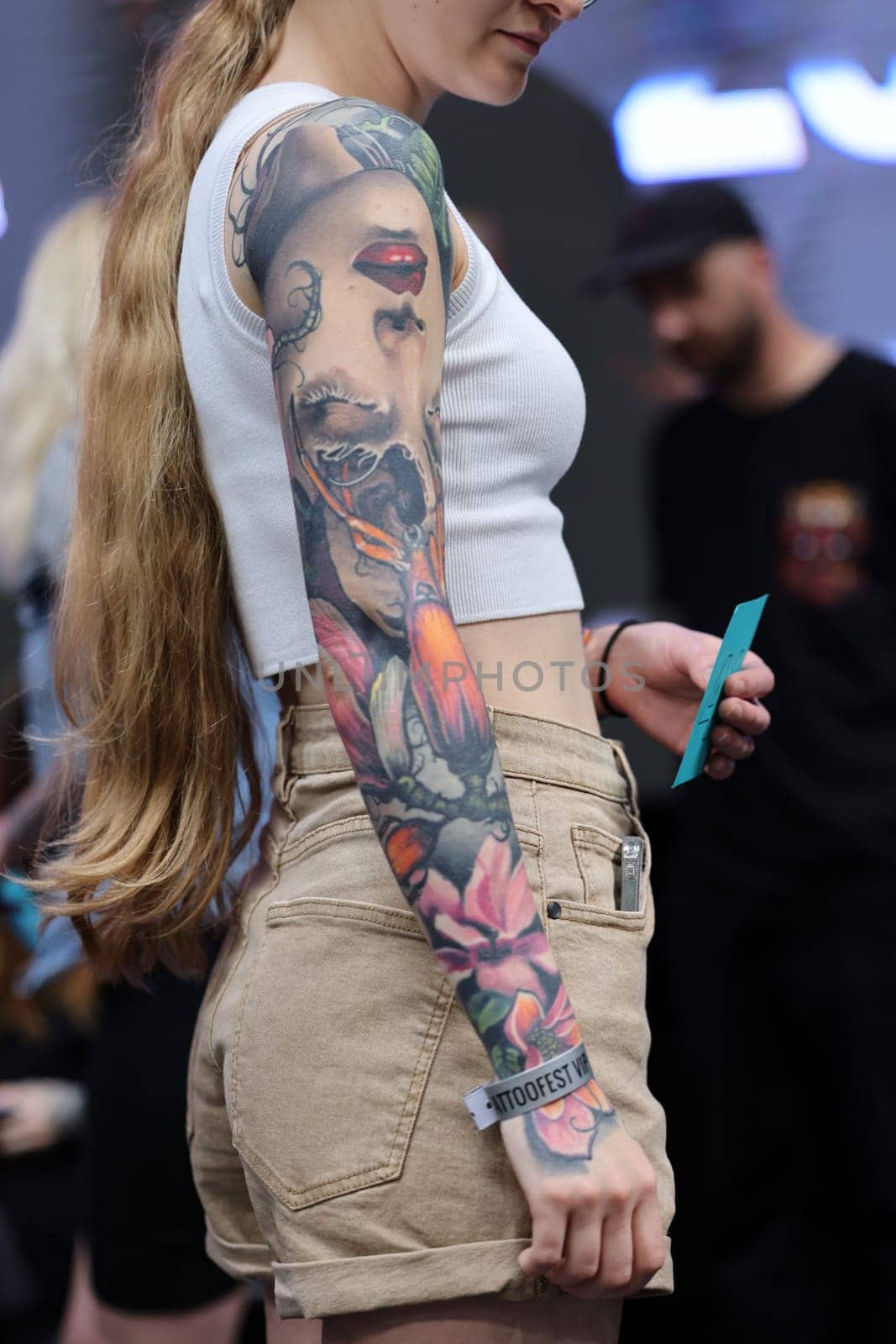 Krakow, Poland - June 12, 2022: Unidentified participant during the contest for the best tattoo at the 15th Tattoofest Convention in Cracow. One of the most prestigious tattoo festivals.