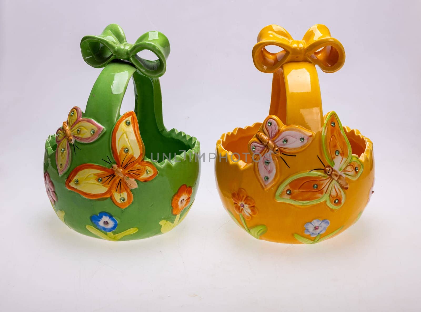 Colorful ceramic Easter decorations with butterfly motifs