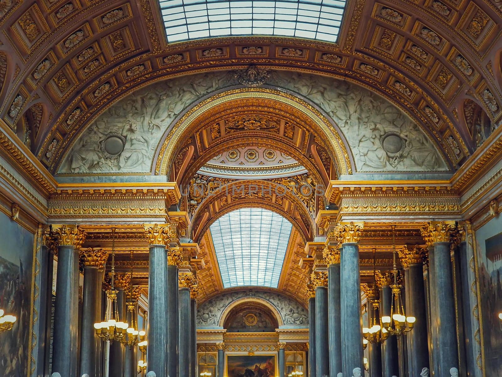 Beautiful architectural details of the Gallery of Great Battles in the palace of Versailles, France. The largest room in the castle, golden ornaments, marble columns