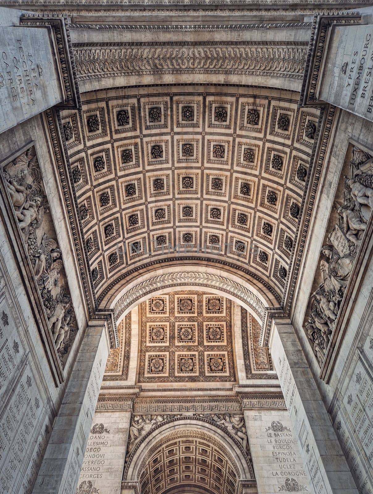 View underneath triumphal Arch in Paris, France. Arc de triomphe, famous historic landmark architecture details