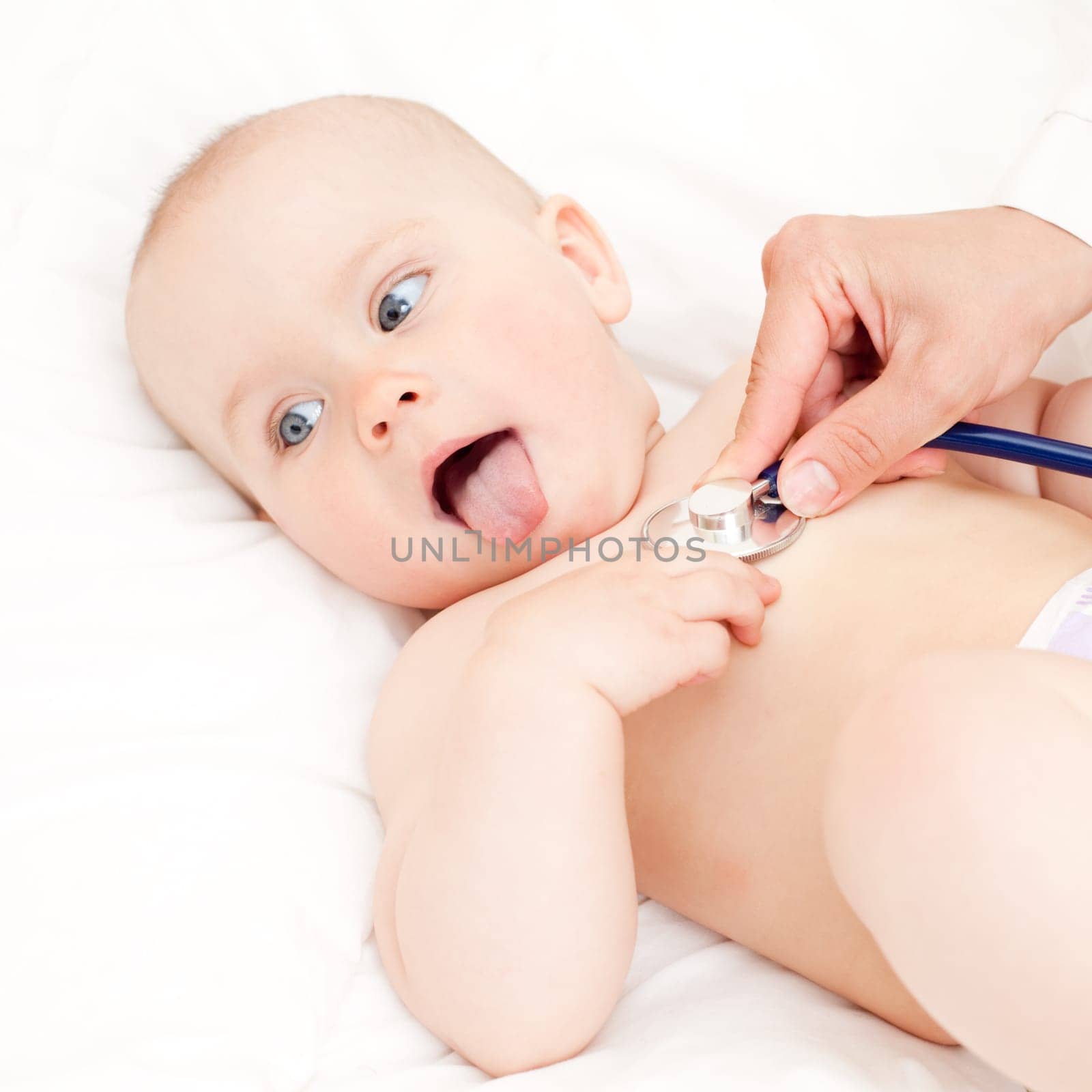 Children's doctor exams infant with stethoscope