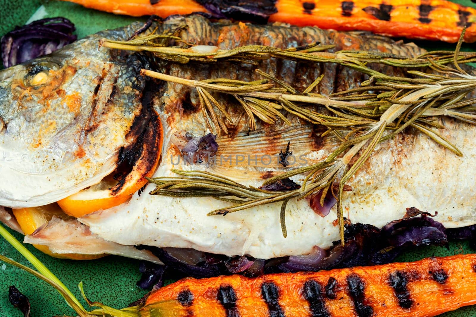 Delicious fish dorada bbq with roasted vegetables. Bbq sea bream.