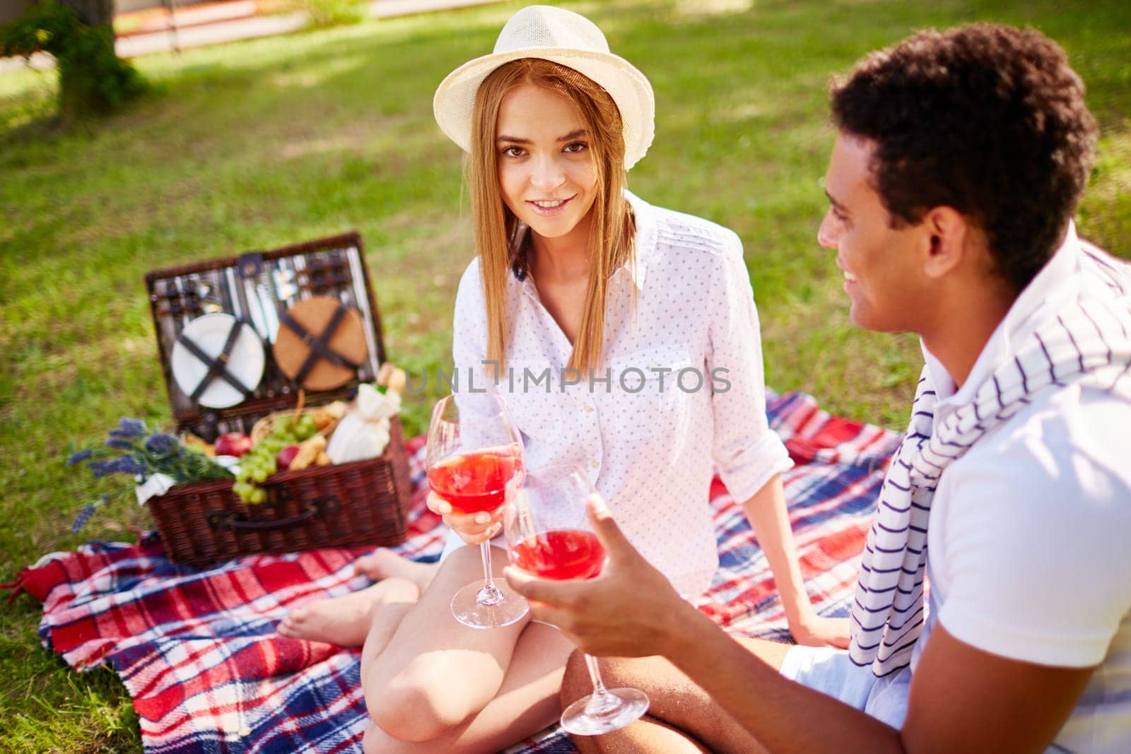 Happy young couple having romantic date in park