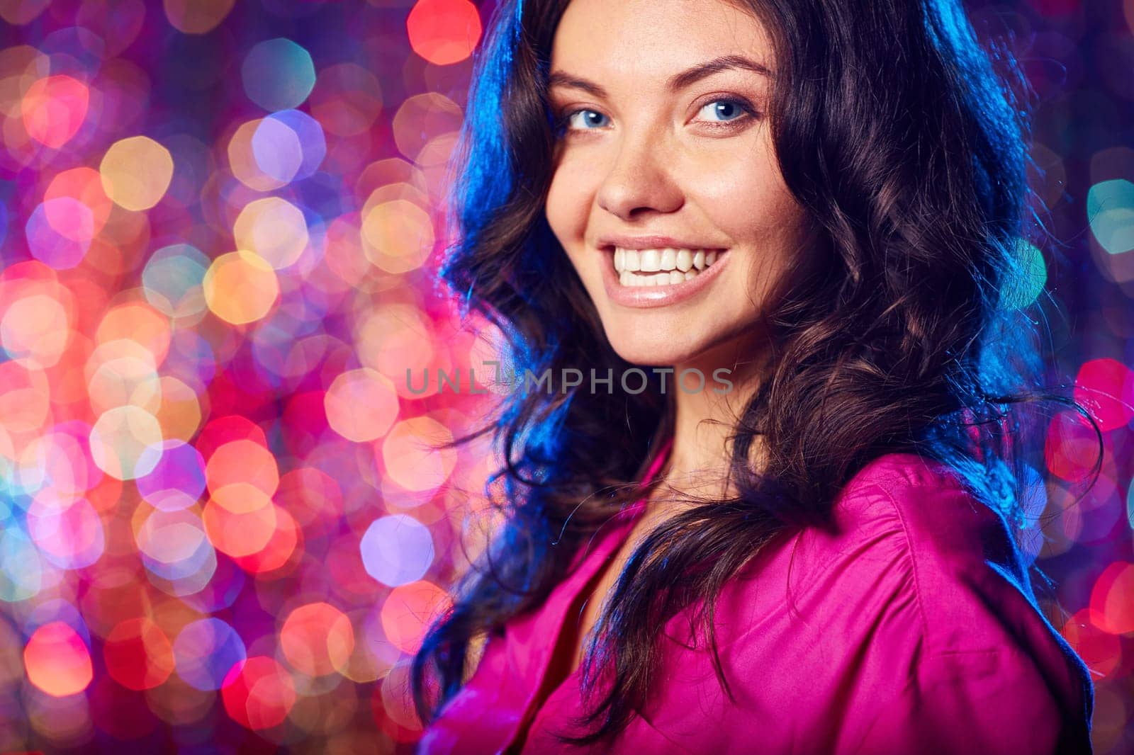 Young brunette looking at camera at party