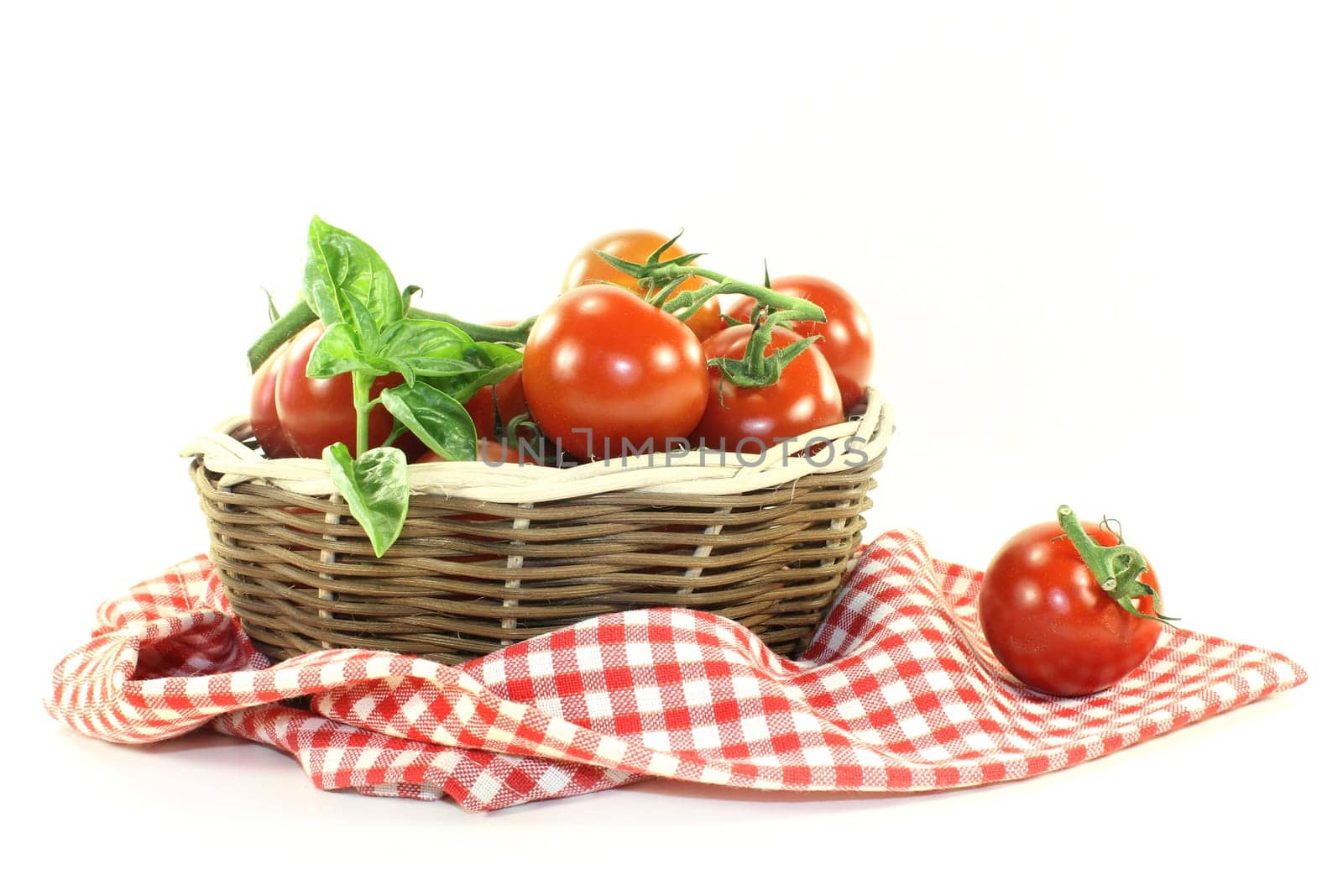 fresh tomatoes in a braided basket