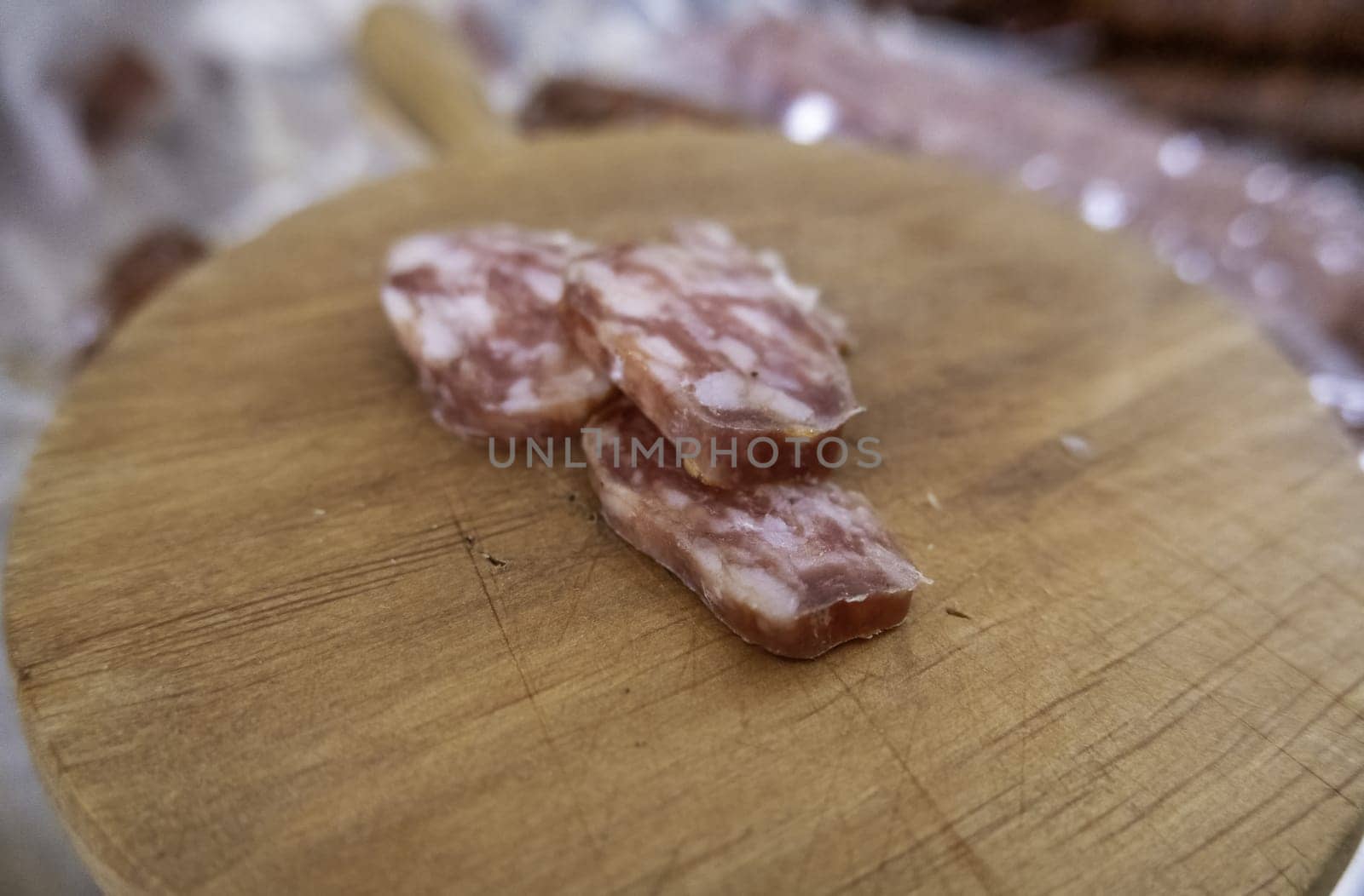 Detail of dried pork sausage in a market, greasy food