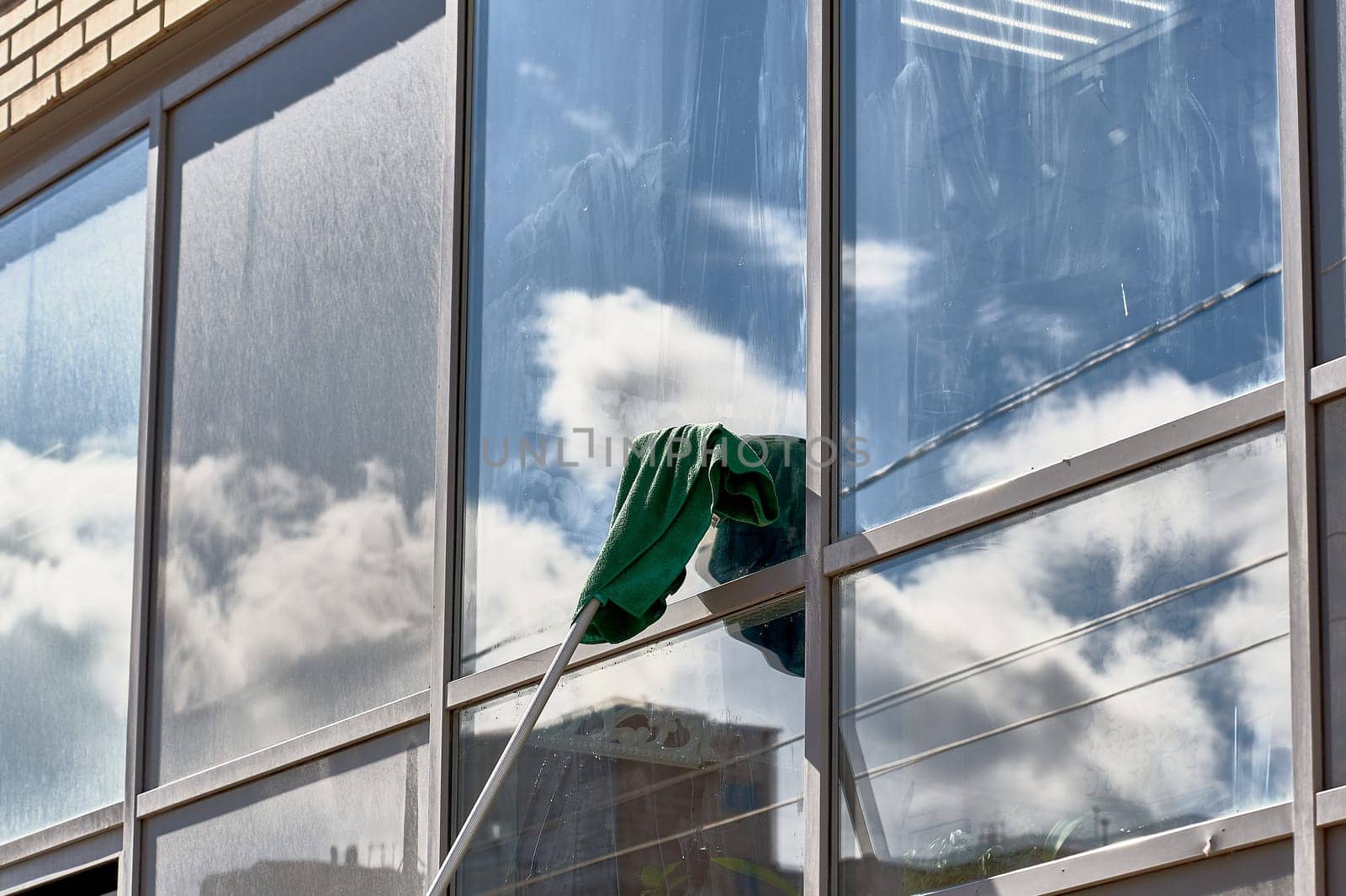 window washing, washing a street shop window. High quality photo