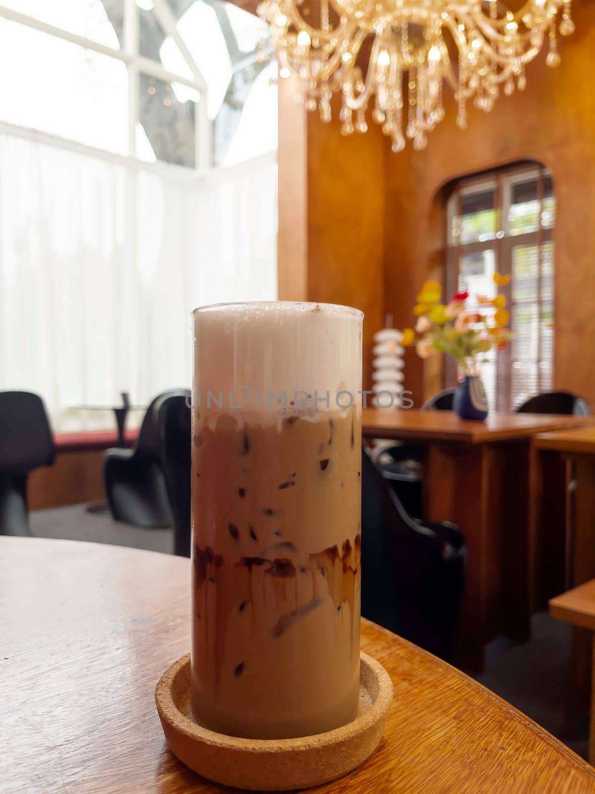 Iced coffee mocha on wooden table, stock photo