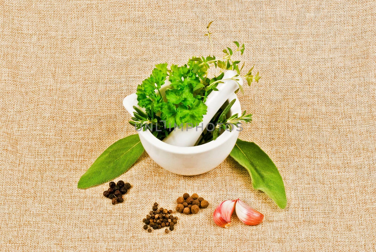 Ceramic pestle of thym, parsley, and rosemary