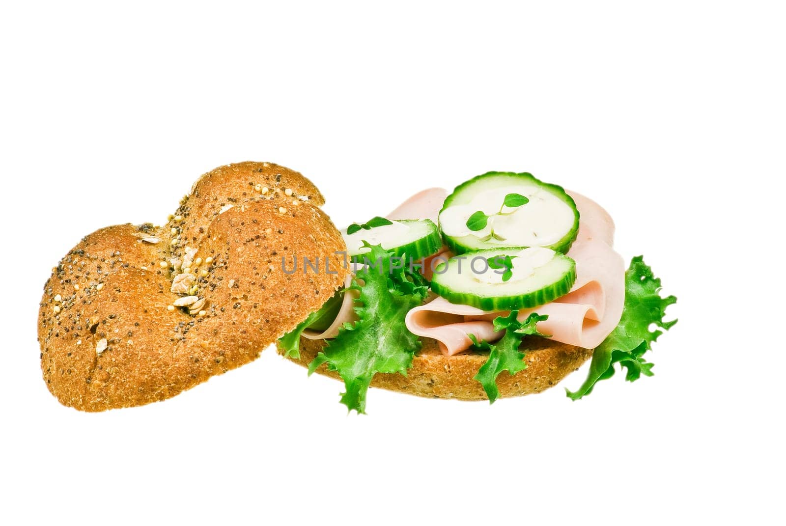 Fresh ham and cucumber sandwich over white background