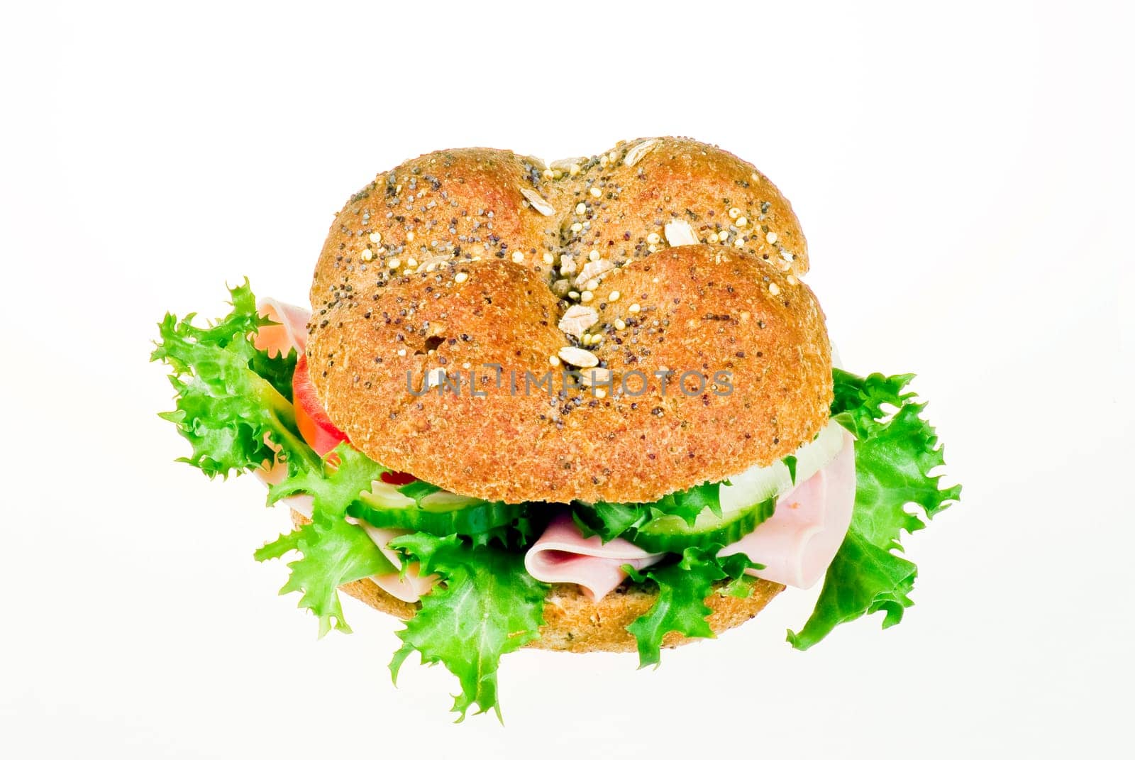 Fresh sandwich with ham and vegetables over white background