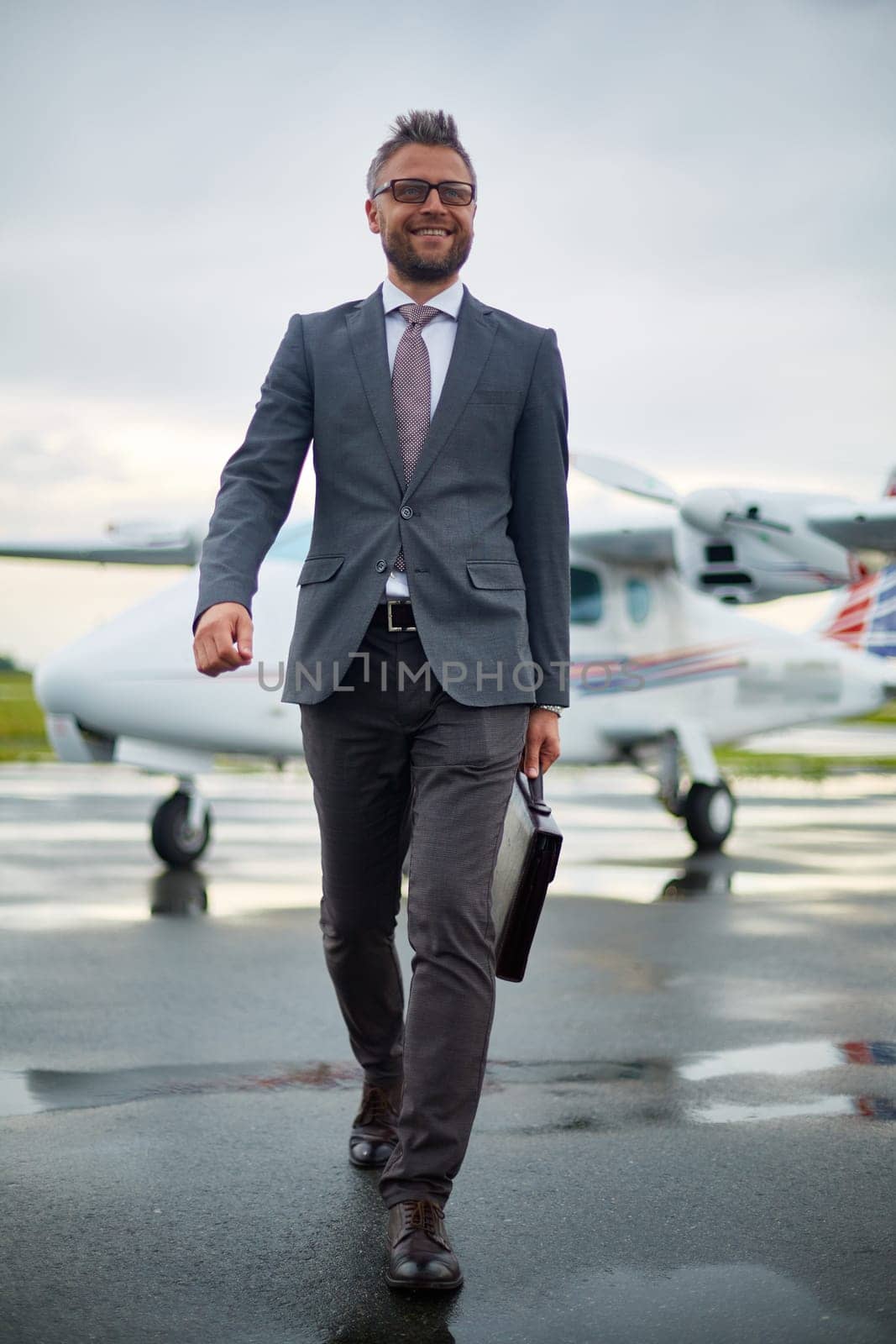 Happy businessman arrived from foreign country to meet with partners