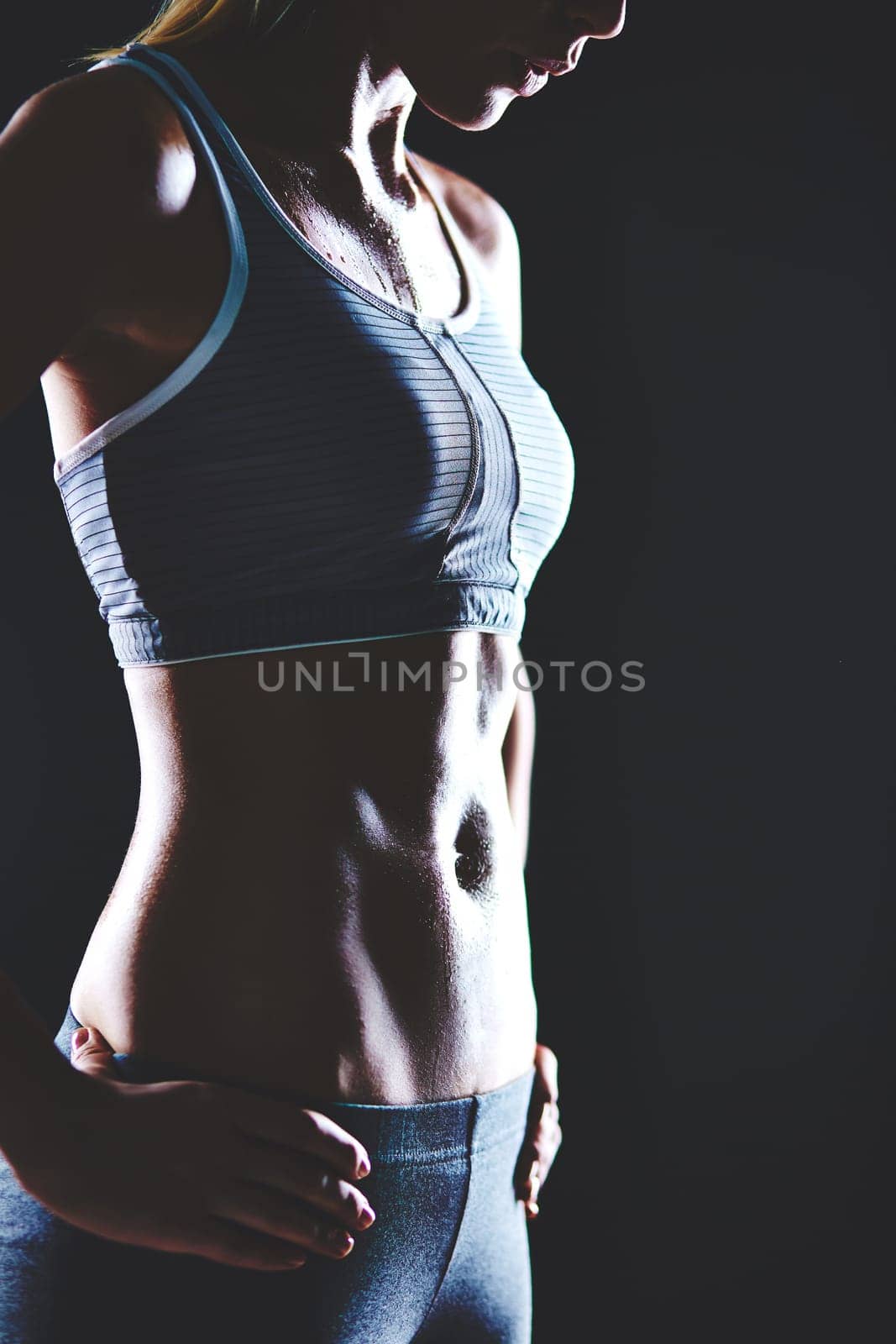 Body of slim female in activewear