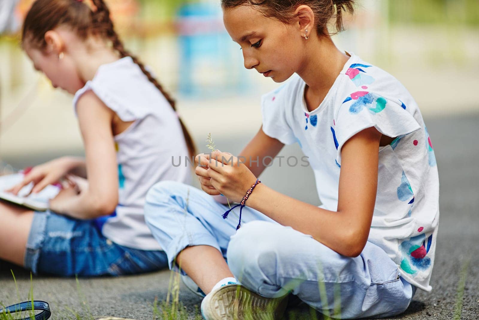 Calm girl having rest outdoors