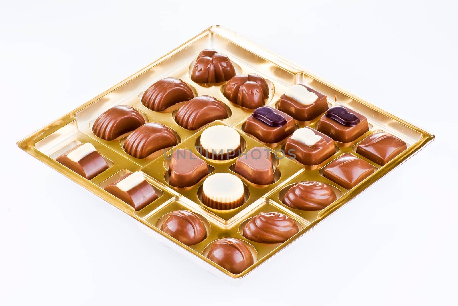 Assorted chocolates in the gold tray