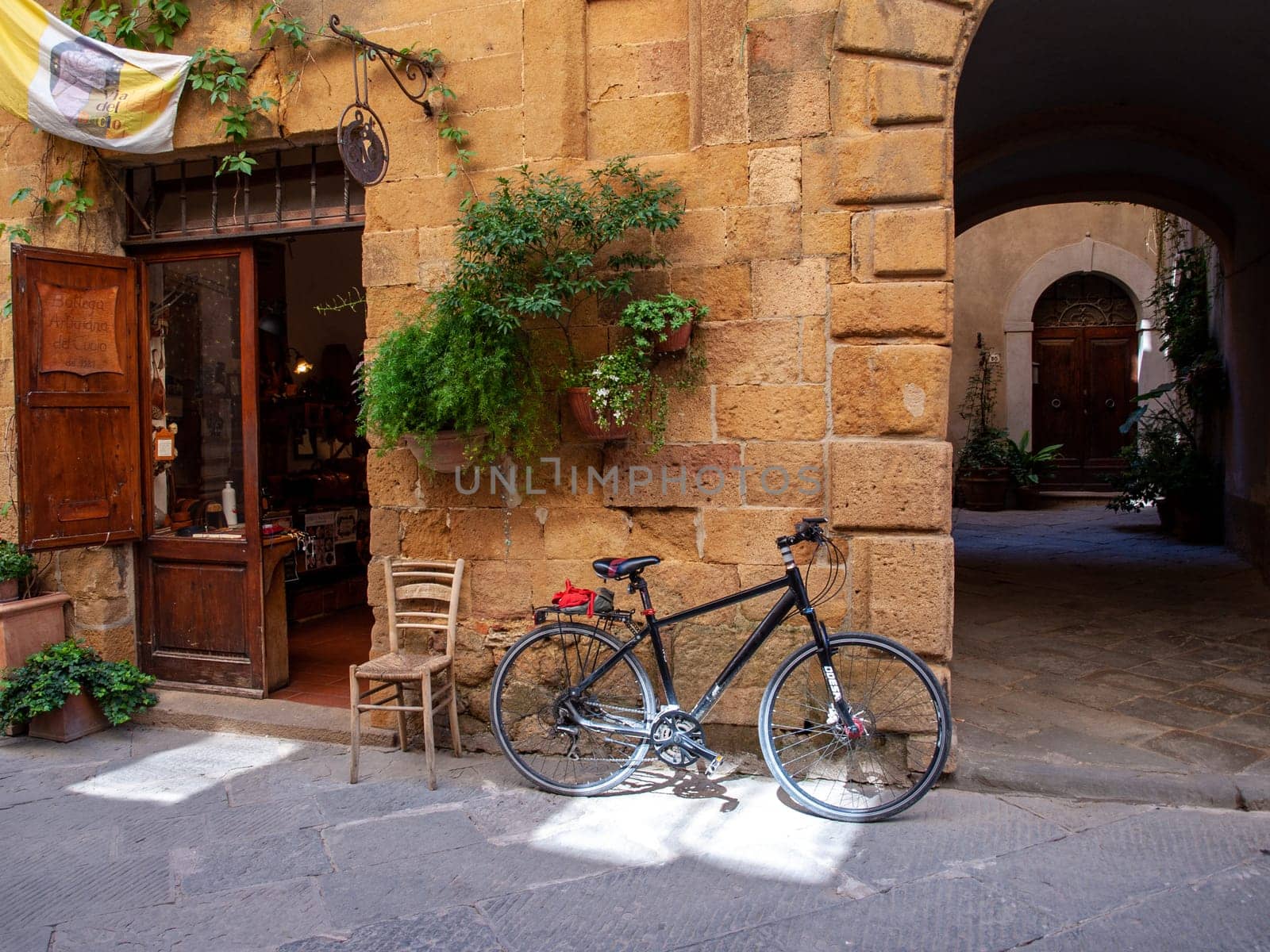 Pienza, Italy - Sept 12, 2022: Pienza, a tiny village in the Tuscany, known as the ideal city of the Renaissance and a capital of pecorino cheese. UNESCO World Heritage Site.