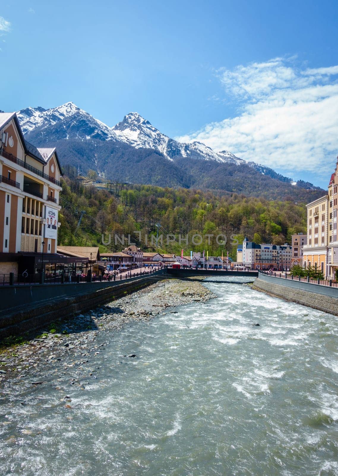 Roza Khutor, Russia, April 15, 2016: Scenic view of the town of Roza Khutor, the Mzymta River and the Caucasus Mountains, This was the site of 2014 Winter Olympic Games