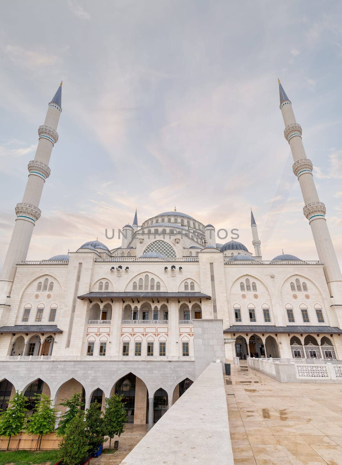 Low angle shot of Grand Camlia Mosque, or Buyuk Camlica Camii, a modern complex for Islamic worship, built in 2019, located in Camlica hill in Uskudar district, Istanbul, Turkey, in a summer day