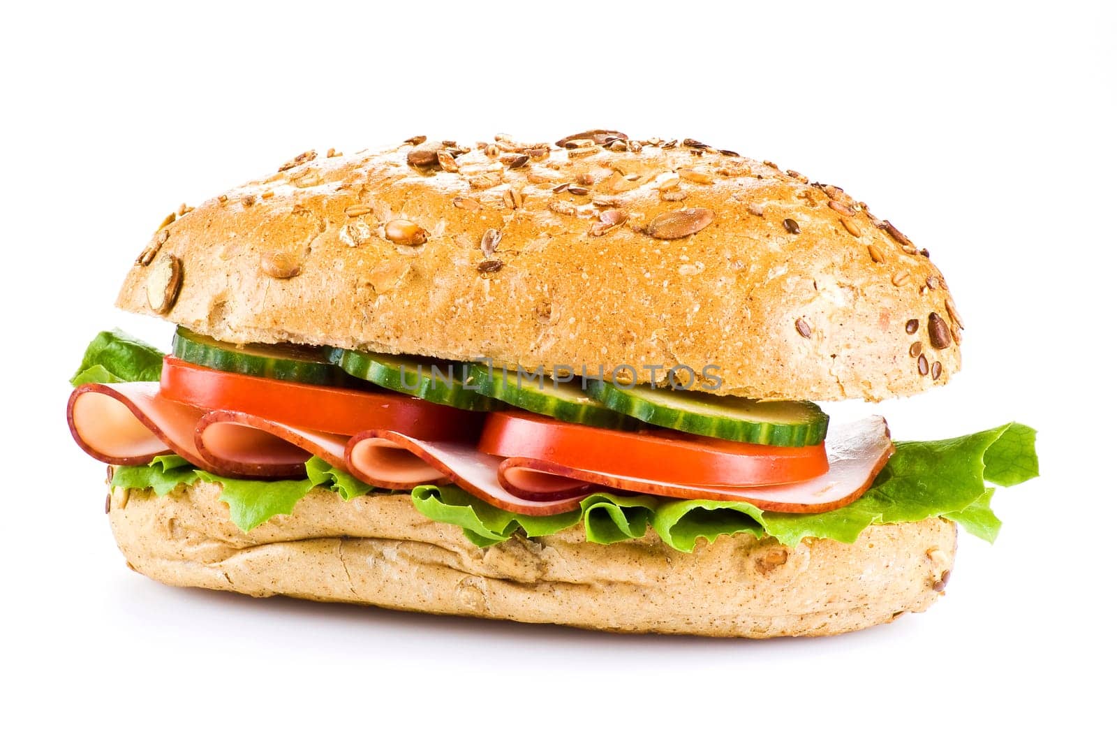 Freshly made sandwich with ham and vegetables over white
