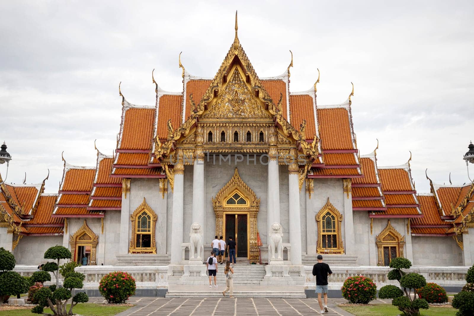 Bangkok, Thailand - Dec 4, 2022 : Tourists visiting Wat Benchamabophit Dusitvanaram (also known as the Marble Temple), a major destination in Bangkok. It shows that Thailand now welcomes tourists.