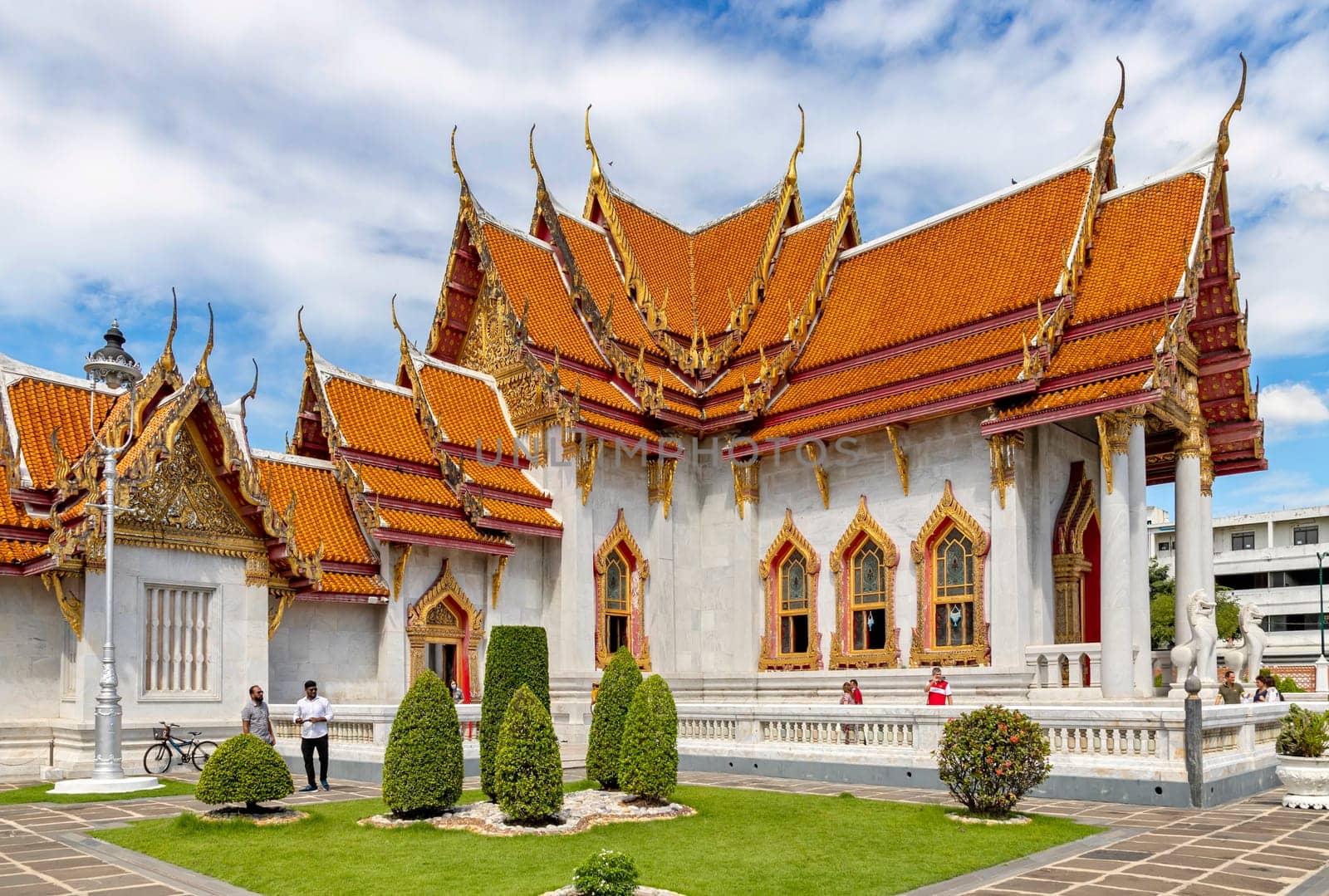 Bangkok, Thailand - Dec 4, 2022 : Tourists visiting Wat Benchamabophit Dusitvanaram (also known as the Marble Temple), a major destination in Bangkok. It shows that Thailand now welcomes tourists.