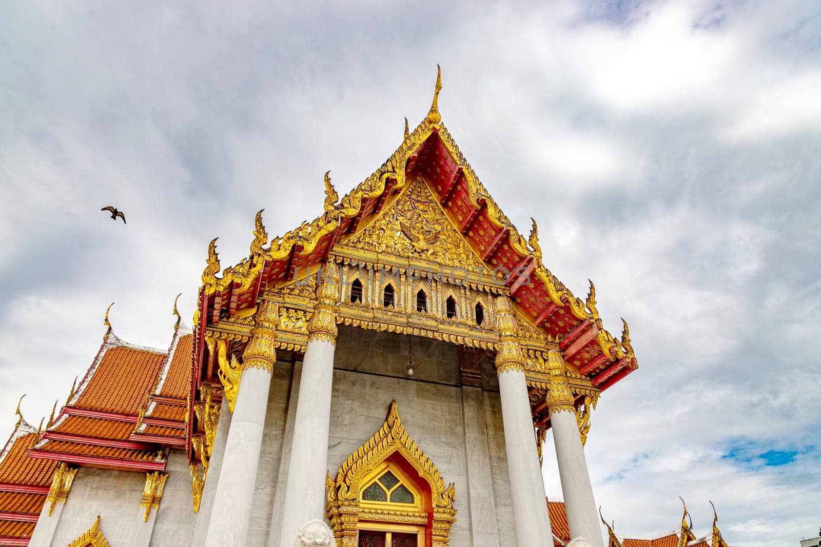 Wat Benchamabophit Dusit Wanaram (This temple is known as the Marble Temple) in Bangkok, blue sky and clouds. One of the most beautiful temples in Thailand Favorite destination in Bangkok. Daytime.