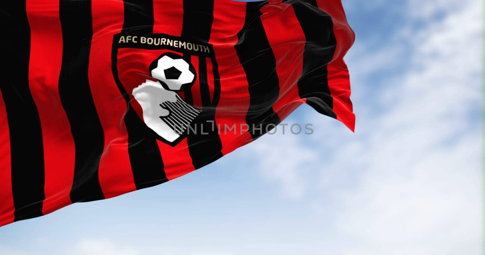 Bournemouth, UK, Oct. 2022: Detail of AFC Bournemouth flag waving. AFC Bournemouth is an English football club based in Kings Park, Boscombe. 3d illustration render. Illustrative editorial