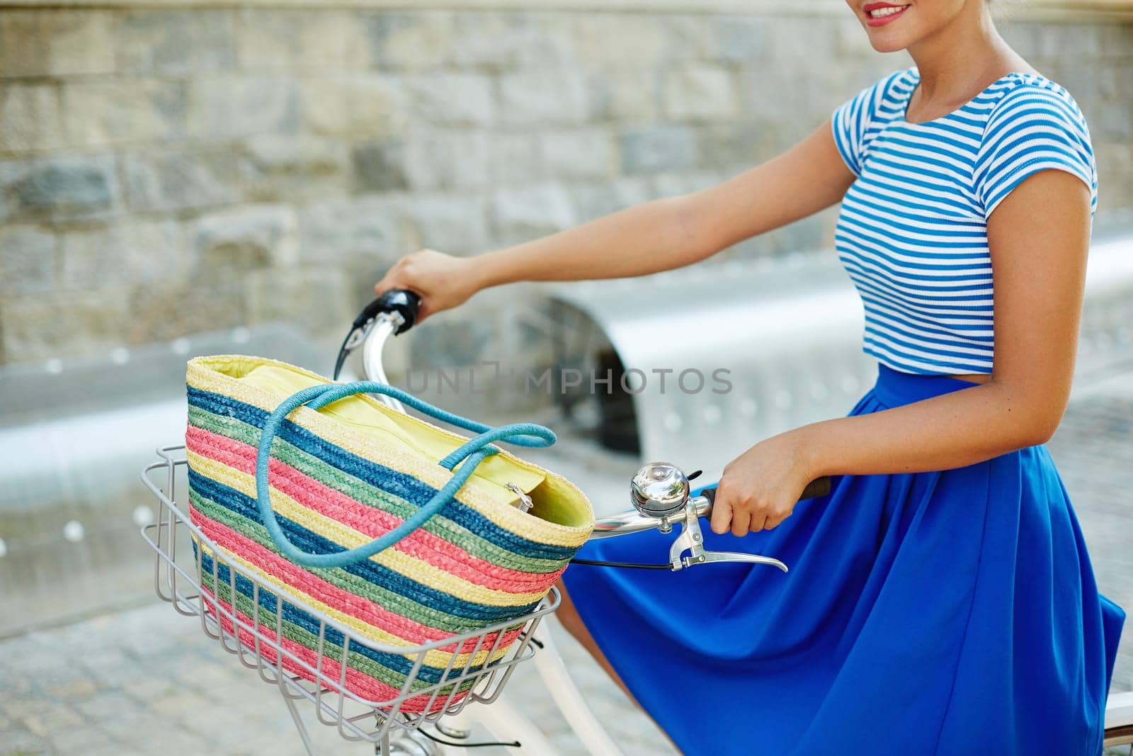 Young female in retro clothes riding bicycle