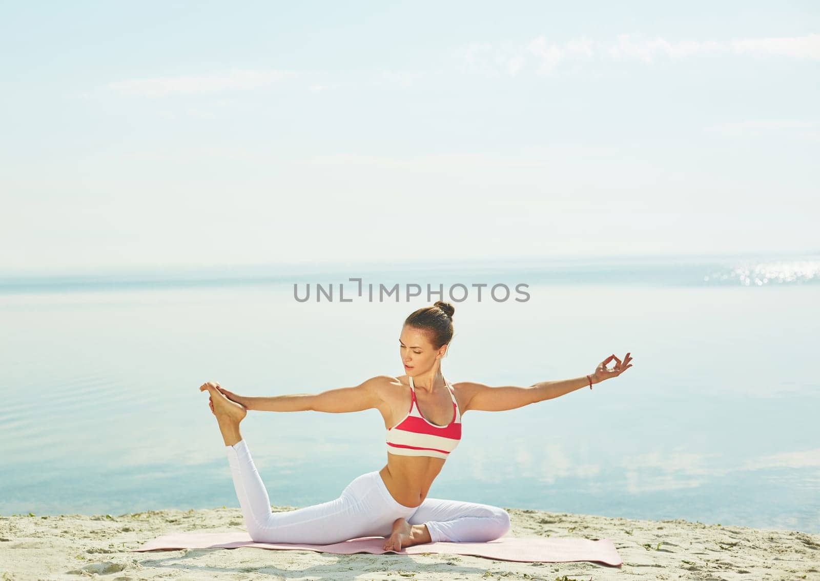 Young woman doing yoga exercise for stretching