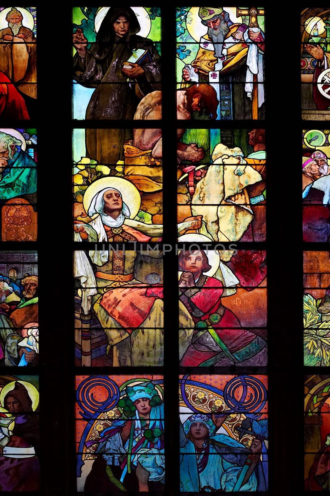 Detail of the color window - "Celebration of the Apostles""..Design: Alfond Mucha (1930)..St Vitus cathedral, Prague, Czech republic, Europe."
