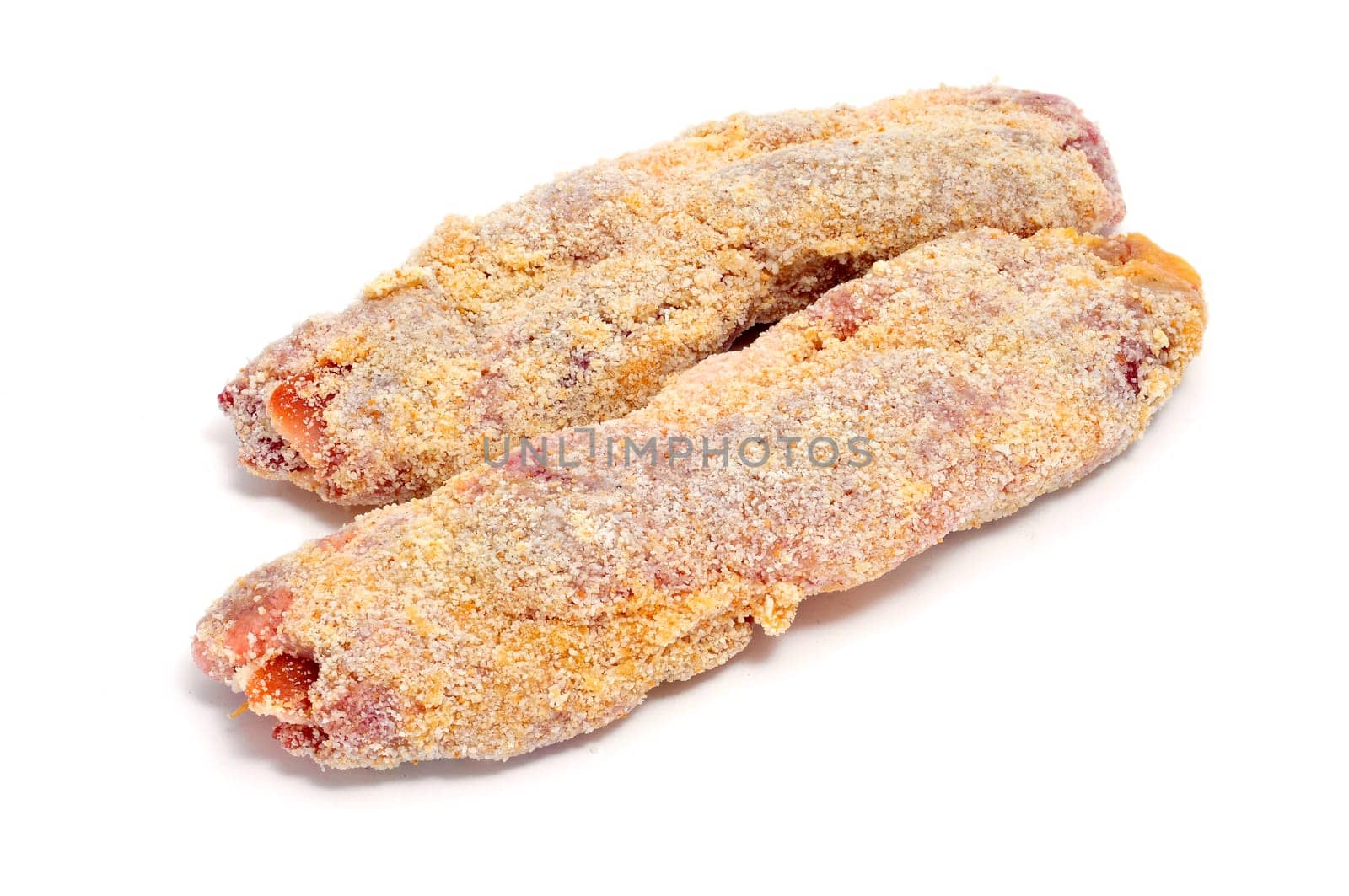some breaded meat rolls ready to fry