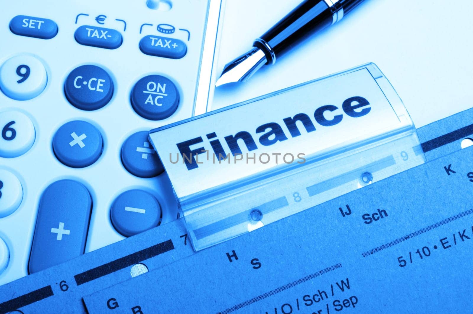 finance on business office folder showing financial success concept