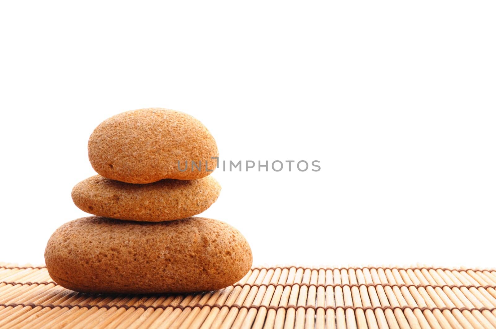 zen stone and green leaf showing spa or wellness concept