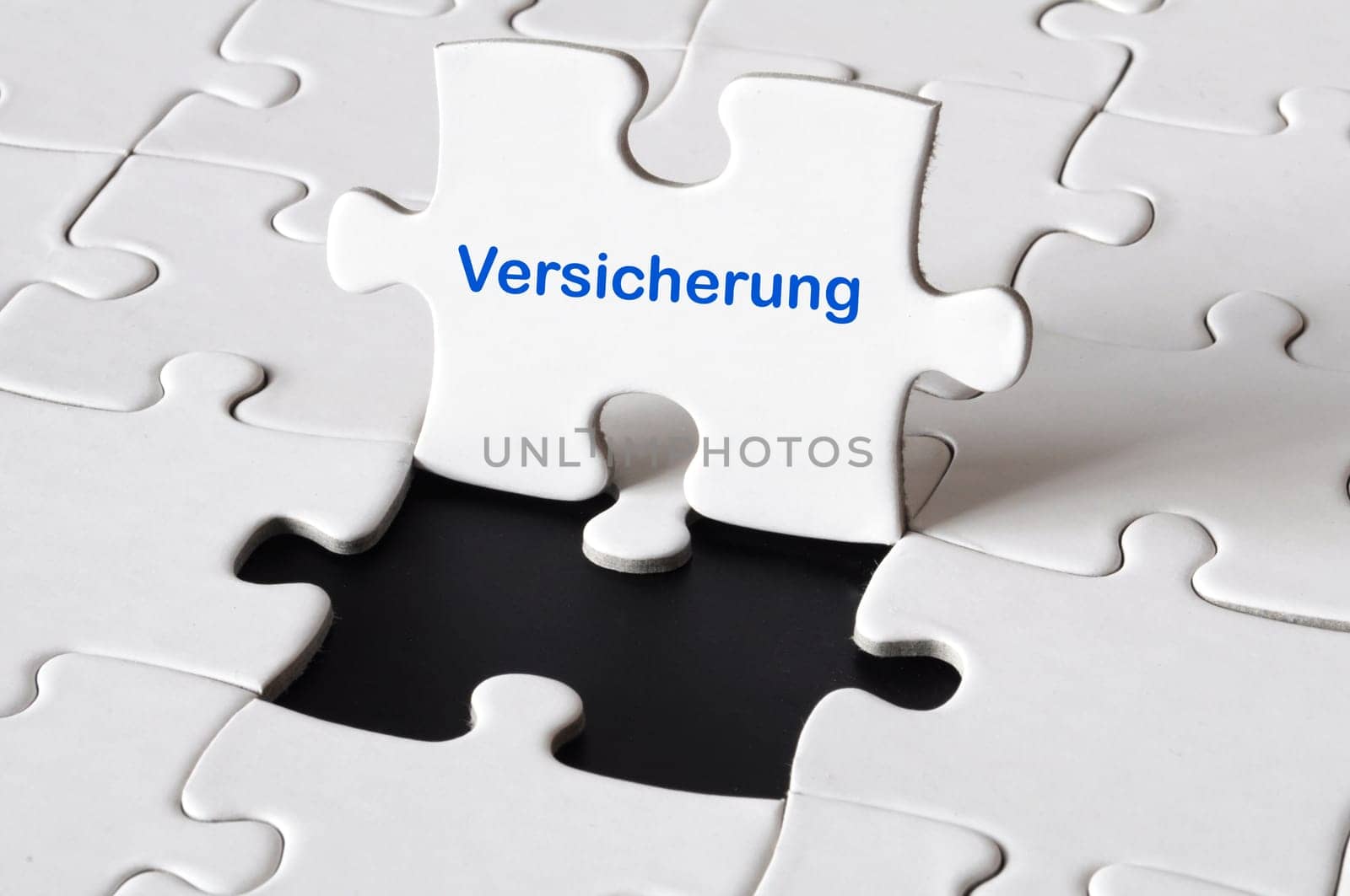 insurance concept with white puzzle or jigsaw