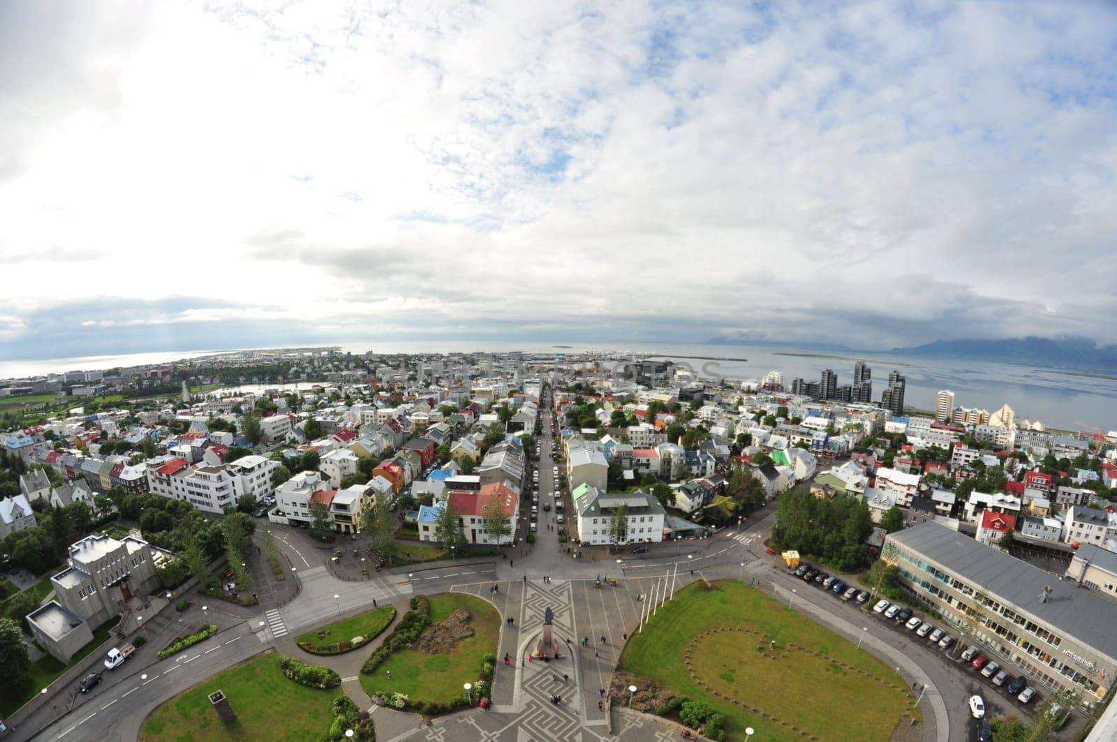 Aerial view of colorful buildings and lush greenery of Reykjavik, Iceland