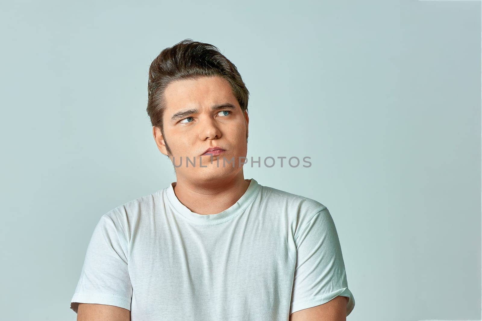 surprised man on a gray background. High quality photo