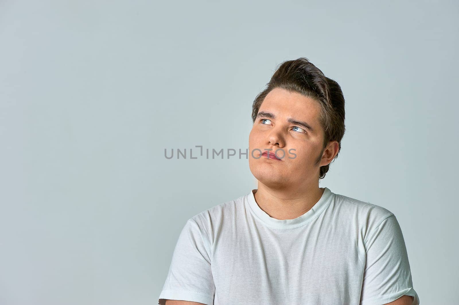 surprised man on a gray background. High quality photo