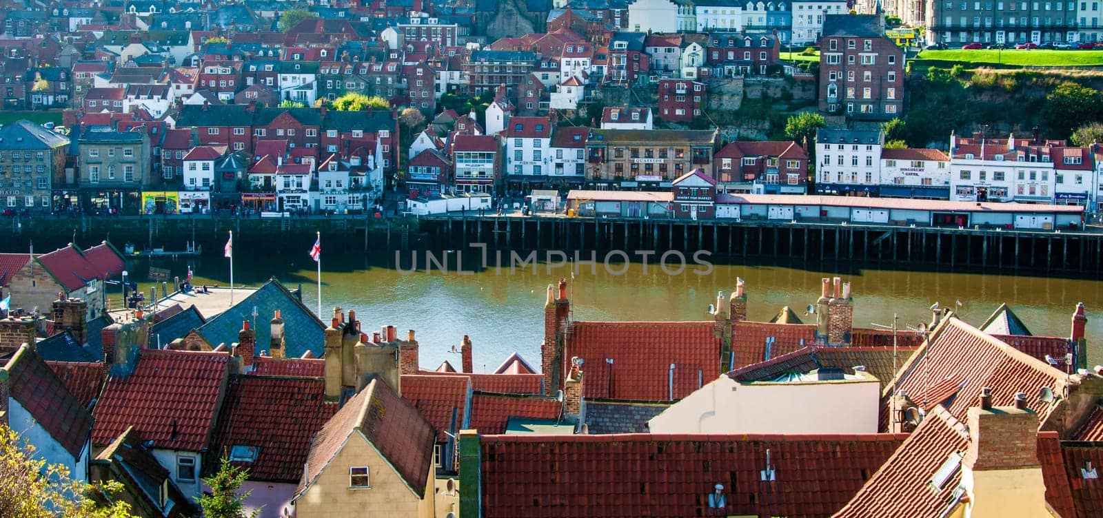 Scenic view of Whitby city in autumn sunny day.Whitby's attraction as a tourist destination is enhanced by its association with the world famous horror novel Dracula, written by Bram Stoker