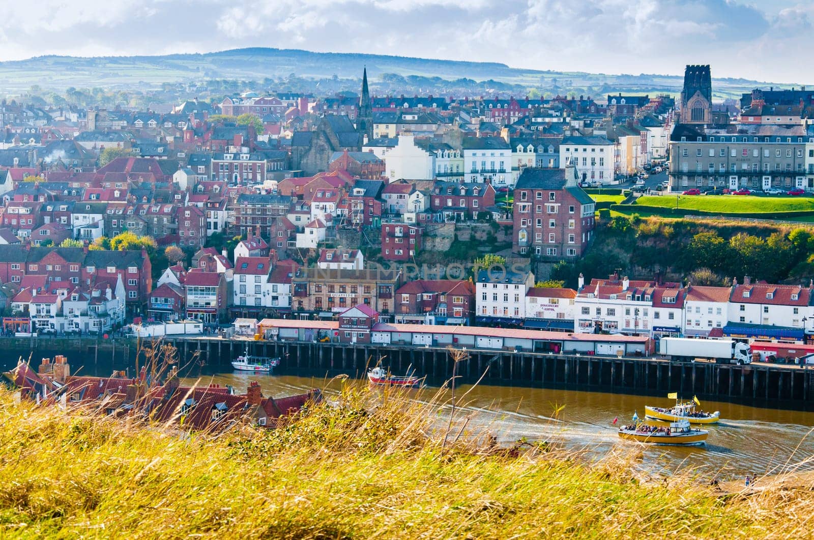 Scenic view of Whitby city in autumn sunny day.Whitby's attraction as a tourist destination is enhanced by its association with the world famous horror novel Dracula, written by Bram Stoker