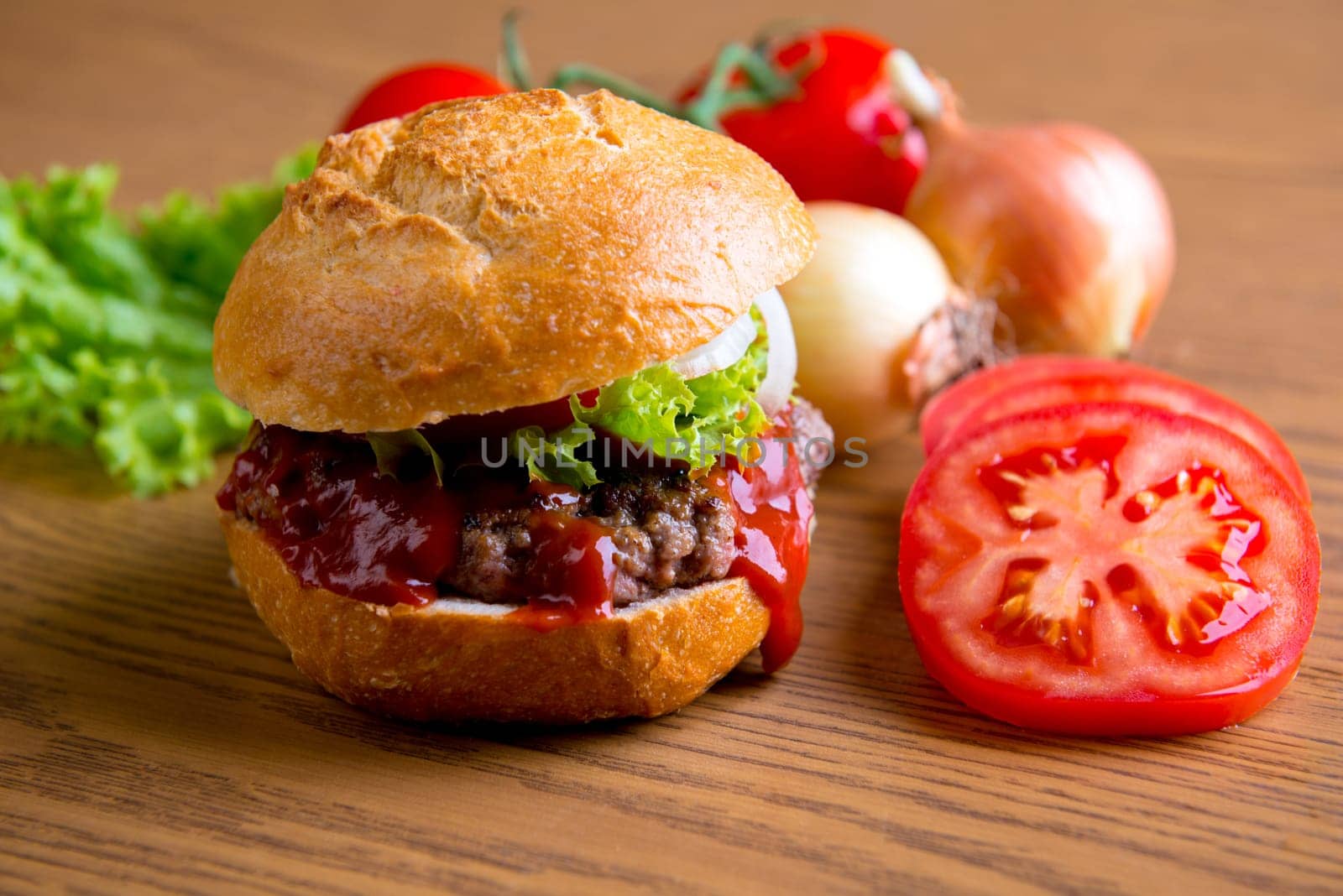 home made hamburger with meat, onion and tomato