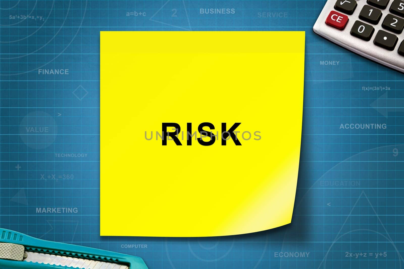 risk text on yellow note with graph paper