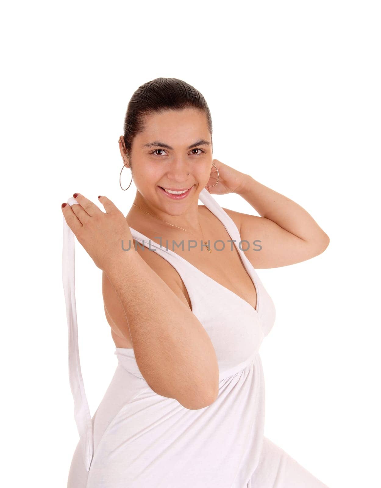 A lovely smiling young woman taking off her white dress, isolated.for white background..