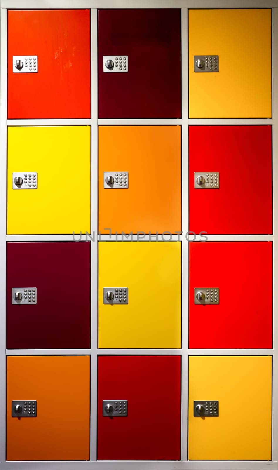 A wardrobe with many lockers in a wide range of colours.