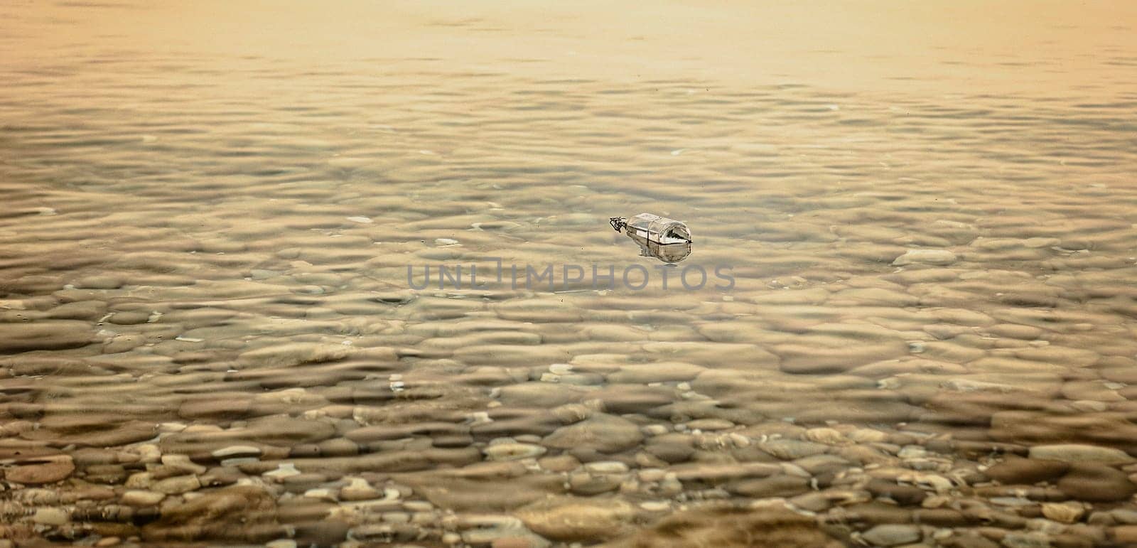 A Message in a Bottle at Sunset