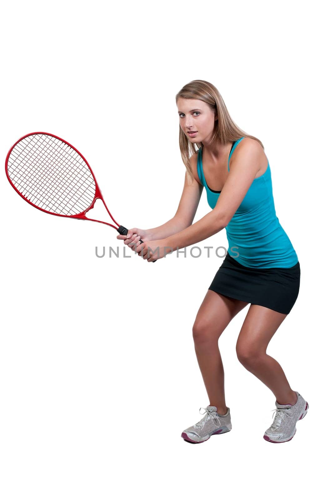 A beautiful woman playing the sports game of tennis